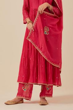 Pink anarkali with sequin hand embroidery and gathered detail. Paired with embroidered pant and embroidered dupatta.
Components: 3
Pattern: Embroidered
Type Of Work: Sequin
Neckline: Scoop
Sleeve Type: Sheer
Fabric: Anarkali and Pant: Chanderi, Dupatta: Tissue Organza
Color: Pink
Other Details: 
Weight: 2 kgs
Length:
Anarkali: 47 inches
Pant: 37 inches
Model is wearing size S
Pant Closure: Elasticated back
Occasion: Puja - Aza Fashions Pink Anarkali, Chanderi Dupatta, Embroidered Pants, Embroidered Dupatta, Hand Work, Sheer Fabric, Pant Set, Sheer Fabrics, Set For Women