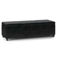 a black bench sitting on top of a white floor