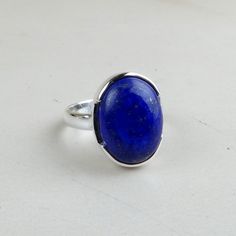 Artisan silver handcrafted gemstone jewellery gifts PRODUCT DESCRIPTION : Lapis Lazuli Rings, 925 Sterling Silver Ring Size 8, Boho Silver Ring, Lapis Silver Ring, Gemstone Silver Ring, Statement Ring, Lapis Ring MATERIAL : 925 Sterling Silver Gemstone - Natural Lapis Lazuli STONE SIZE - 12x16 mm STONE SHAPE - Oval STONE TYPE - Cabochon TOTAL WEIGHT : 6-9 Grams (Approx) A top-notch product with 100% genuine and real gemstones.. Each one of our product is backed by a deep thinking of fashion, wearability and class. Each and every product represents the passion and love we have for the jewelry profession.. We tend to deliver sellar products with natural and real gemstones studded in solid Sterling Silver to cater the requirements of our classy customers. We accept custom and personalized ord Round Lapis Lazuli Cabochon Rings, Lapis Lazuli Cabochon Rings, Classic Round Lapis Lazuli Jewelry, Formal Lapis Lazuli Gemstone Ring, Elegant Lapis Lazuli Ring Jewelry, Formal Lapis Lazuli Ring Jewelry, Fine Jewelry With Lapis Lazuli Gemstone, Sterling Silver Rings With Natural Stones, Oval Sterling Silver Gemstones With Polished Finish