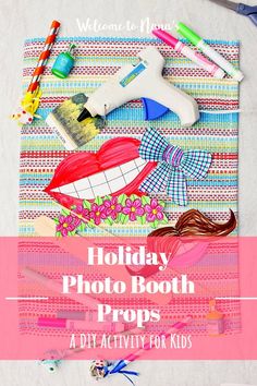 the holiday photo booth props are displayed on a table with scissors and other crafting supplies