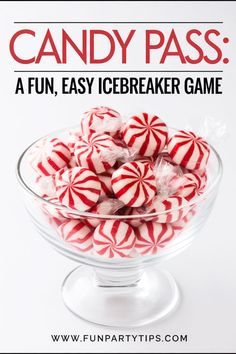 a glass bowl filled with candy pieces on top of a white table next to the words candy pass