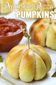 pepperoni pizza pumpkins are sitting on a table with dipping sauce in the background