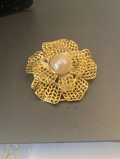 Goldtone filigree flower scarf clip with a faux pearl center Elegant Spring Brooch Jewelry, Elegant Spring Brooch, Elegant Gold Brooches For Spring, Scarf Clip, Flower Scarf, Faux Pearl, Scarf Wrap, Scarf Accessory, Gold Tones