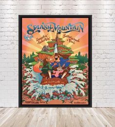 the poster for splash mountain is displayed in front of a brick wall