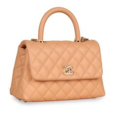 Crafted from caviar leather in Salmon Pink, Chanel presents the Small Coco Top Handle bag. Featuring champagne gold tone hardware, an interwoven chain / leather shoulder strap and a durable top handle, the Coco is the perfect balance between timeless elegance and modern edginess. Sophisticated and feminine yet perfectly in tune with modern fashion, this gorgeous bag is the ideal piece to compliment anything in your wardrobe. No matter the occasion, the Coco Top Handle can easily hold all your essentials from day to night while keeping you sleek and stylish. An investment piece you won't regret purchasing, this exquisite handbag is a true must-have for any woman with a love for luxury and a soft spot for Chanel. SPL Exterior Salmon Pink/Nude Caviar Leather Size Small Champagne gold tone har Coco Handle, Soft Spot, Pink Chanel, Salmon Pink, Gorgeous Bags, Champagne Gold, Leather Chain, Exclusive Bag, Handle Bag