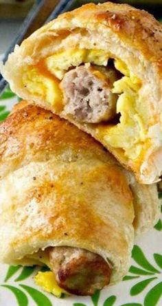 an egg and sausage breakfast roll on a plate