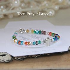 Teen girl bracelet in multi-colored crystal beadsTeen bracelet with prayerSilver cross Clasp closure Teen Prayer: Wear as a reminder that Jesus loves you very much. I pray that you become the woman that God wants you to be. Proverbs 31:10Gift boxMade in the USA Coolest Crafts, Prayer Crafts, Wwjd Bracelet, Faith Bracelet, Girl Bracelet, Prayer Bracelet, Holiday Planner, Love You Very Much, Proverbs 31