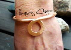 This simple, yet elegant copper cuff bracelet is completely hand crafted from copper wire, hand hammered, and is available in a brushed, polished, or antiqued finish. (select your desired finish from the drop down menu) It is an absolute favorite of mine!! I often pair this circle drop bracelet, for a layered and stacked look, with my three piece copper bracelets set found here: https://www.etsy.com/listing/499787894/copper-bracelets-copper-bangle-twisted Available in sizes 5 - 8 1/2 (select des Copper Jewelry Diy, Handmade Copper Bracelet, Wire Jewelry Earrings, Copper Wire Art, Copper Bracelets, Hammered Jewelry, Copper Anniversary, Bijoux Fil Aluminium, Copper Jewelry Handmade