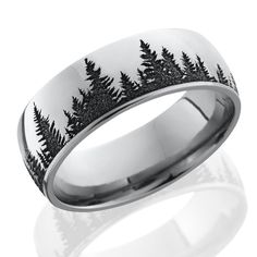 a wedding ring with trees on the inside and black inlays, is shown