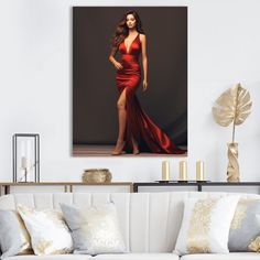 a woman in a red dress is standing on a couch