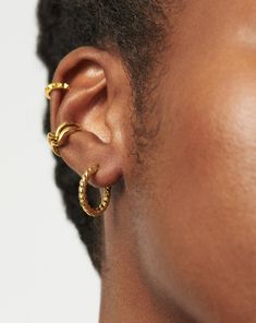 Twisted Helical Small Hoop Earrings | 18ct Gold Plated Vermeil. Introducing Our Lightest Ever Hoops — an Elevated Collection of Everyday Essentials that are Anything but Basic. Our Best Selling Helical Mini Hoops Have Been Upgraded with a Modern Twist. Plus, they Feature a Hidden Hinge for a Seamless Closure. Wear Solo or Style with Studs and Mini Hoops for an Instant Ear Stack. Metal: 18Ct Recycled Gold Plated Vermeil on Sterling Silver Hoop Dimensions: 18mm X 18mm Weight: 4g Product Code: Mh-G Double Chain Bracelet, Malachite Necklace, Small Hoop Earrings, Snake Chain Bracelets, Ear Stack, Pearl Pendant Necklace, Recycled Gold, Coin Necklace, Sterling Silver Hoops