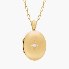 Carry loved ones close with this premium 14k yellow gold, oval locket featuring one round diamond. It opens with a snap clasp, holds two photos and is suspended from a 30-inch cable chain. This substantial locket can be engraved on the back for a personalized gift. Classic Oval Locket Necklace Stamped 14k, Luxury Yellow Gold Oval Locket Necklace, Yellow Gold Oval Link Locket Necklace, Yellow Gold Oval Locket Necklace, Classic Yellow Gold Locket Necklace With Oval Link, Personalized Oval Locket Necklace In Yellow Gold, Timeless Gold Oval Locket Necklace, Classic Yellow Gold Oval Link Locket Necklace, Classic Yellow Gold Oval Locket Necklace