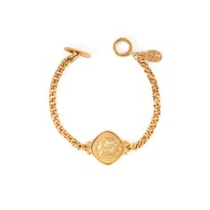 The Camille Bracelet from Laurine's Voyage Collection is a work of art. This intricate bracelet is made from tin alloy and then electroplated with 24kt gold. The Camille Bracelet measures 6.75" and has a toggle closure. Whether you're treating yourself or someone special, this bracelet is sure to impress. Made-to-order in our New York City Design Studio. Please allow 7-14 business days for production before the ship date. Gold Plated Bracelet With Toggle Clasp, Gold Metal Bracelet With Toggle Clasp, Gold-tone Brass Jewelry With Toggle Clasp, Vintage Gold Tarnish-resistant Bracelet, Adjustable Brass Jewelry With Toggle Clasp, Gold Brass Bracelets With Toggle Clasp, Gold Engraved Metal Chain Bracelet, Vintage Adjustable Gold-plated Bracelet, Adjustable Vintage Gold-plated Gold Bracelet