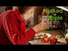 an older woman is making baked apples in the kitchen with her hands and spoons