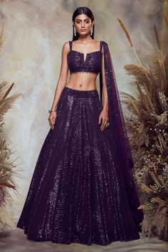 Purple lehenga with all-over sequin embroidery. Comes with blouse and net dupatta.
Components:3
Pattern:Embroidery
Type of Work:Sequin
Neckline:Notch
Sleeve Length:Sleeveless
Fabric:Net
Color:Purple
Other Details:
Blouse with bead drops
Shoulder straps
Blouse with sequin embroidery border
Closure: Side zip
Occasion:Bride - Aza Fashions Shimmer Lehenga, Lehenga Purple, Lengha Blouse Designs, Sequin Lehenga, Purple Lehenga, Sangeet Outfit, Raw Silk Lehenga, Lehenga Designs Simple, Embroidered Lehenga