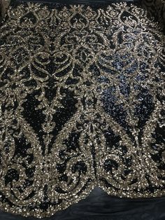 Luxury Embroidered Black Sequin Fabric, Black Embellished Sequin Fabric, Glamorous Style, Embellished Black Sequin Fabric For Prom, Black Embellished Sequin Fabric For Prom, Glamorous Embroidered Sequin Fabric For Party, Elegant Fitted Sequin Fabric, Elegant Black Sequin Fabric With Contrast Sequin, Elegant Black Sequin Fabric For Party, Elegant Black Sequin Fabric For Party Season