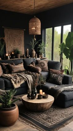 a living room filled with lots of furniture and plants