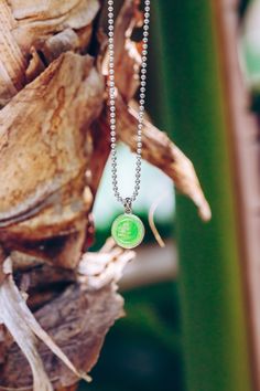 necklace hanging from palm tree Everyday Green Emerald Pendant Necklace, Adjustable Green Turquoise Pendant Necklace, Green Tarnish-resistant Pendant Necklace, Mens St Christopher Necklace, Surf Necklace, St Christopher Necklace, St Christopher Pendant, Retro Surf, Saint Christopher