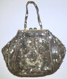 Lined inside. Flower and rhinestone closure and metal frame. Beaded handle and fully beaded bag. Vintage bag. Condition is Pre-owned. Shipped with USPS Priority Mail. Formal Rectangular Bags With Sequins, Formal Sequined Rectangular Bags, Gold Sequined Shoulder Bag For Evening, Gold Embellished Bags, Glamorous Embellished Bags, Glamorous Formal Shoulder Bag With Sequins, Elegant Formal Shoulder Bag With Sequins, Silver Embellished Bags For Celebration, Elegant Sequined Shoulder Bag For Formal Events