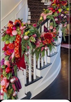 christmas decorations on the banisters and handrails are decorated with red, green and pink flowers