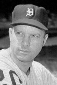 a black and white photo of a baseball player