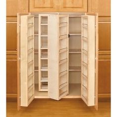 an open cabinet with several shelves in it