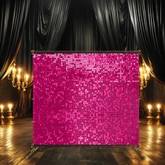 an empty stage with pink sequins on it