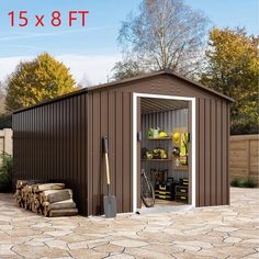 a shed with its doors open and tools in the yard next to it is shown