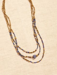 DESTINATION COLLECTION: Designed for dreamers, these pieces reflect the distinctive beauty of the destinations that inspired them, showcasing the striking qualities of semi-precious stones and natural materials as a call to explore- even if only in t Spiritual Multi-strand Beaded Necklace With Natural Stones, Spiritual Beaded Necklaces For Layering, Blue Natural Stones Jewelry For Layering, Blue Jewelry With Natural Stones For Layering, Polished Round Beads Jewelry For Layering, Bohemian Lapis Lazuli Beaded Necklace With Gemstones, Bohemian Lapis Lazuli Jewelry With Gemstone Beads, Multi-strand Beaded Healing Jewelry, Adjustable Multi-strand Gemstone Beaded Necklace