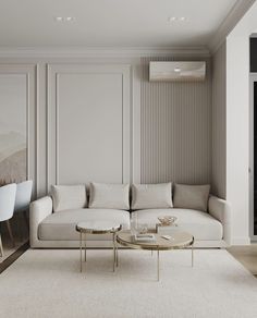 a living room filled with furniture and white walls