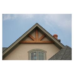 the top of a house with a sky background