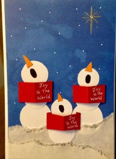 a christmas card with two snowmen and the words joy to the world written on them