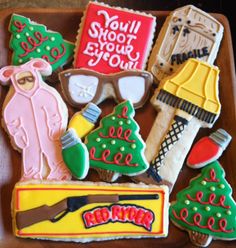 decorated cookies in the shape of christmas trees, snowmen and skis on a tray