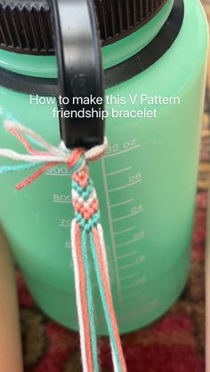 a close up of a measuring cup with yarn on it