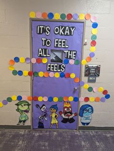 a door decorated with paper circles and the words it's okay to feel all the feels