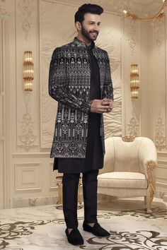 Introducing our exclusive U2-S340 Mens Sherwani. Crafted with the finest thread embroidery, this open jacket exudes sophistication and luxury. Elevate your style and capture attention with this tasteful and elegant piece. Add it to your wardrobe and make a statement at any event. Designer Sherwani With Chikankari Embroidery And Long Sleeves, Designer Long Sleeve Sherwani With Chikankari Embroidery, Designer Bandhgala For Winter Reception, Designer Winter Bandhgala For Reception, Designer Black Kurta With Naqshi, Elegant Formal Outerwear With Chikankari Embroidery, Designer Sherwani For Reception In Winter, Designer Winter Sherwani For Reception, Designer Winter Reception Sherwani