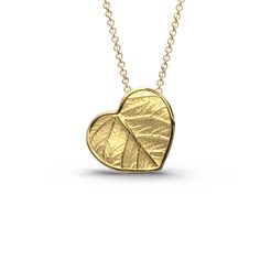 Elevate your style with our Italian 14k or 18k gold heart pendant and chain. Inspired by the beauty of nature, this exquisite heart pendant features a delicate leaf motif, infusing elegance and charm into every detail. Crafted with precision in Italy, this enchanting piece is a symbol of love and sophistication. A perfect accessory to cherish or to gift to someone special. 14k or 18k gold 20 mm high 20 mm large 18k Rolò chain chain length 45cm chain thickness 1.5mm designed and crafted in Italy