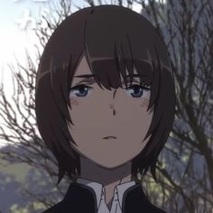 an anime character with brown hair and blue eyes looks at the camera while standing in front of trees