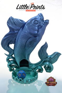 a blue fish figurine is on display in front of a white background with the title, little prints