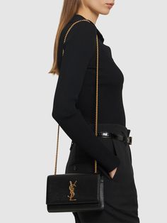 Height: 12.5cm Width: 20cm Depth: 5cm. Shoulder strap length: 56cm. Metal chain shoulder strap . Front flap with magnetic button closure. Front metal logo Ysl Kate Bag, Ysl Wallet On Chain, Ysl Crossbody Bag, Ysl Kate, Kate Bags, Ysl Wallet, Black Envelopes, Versace Brand, The Saint