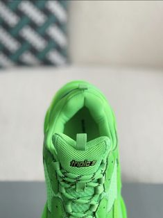 Turn heads and break boundaries with these neon green Balenciaga Triple S-inspired sneakers. The electrifying colorway and signature chunky sole make a bold statement, while the premium materials ensure lasting comfort. Embrace the avant-garde and step into the future of footwear. Functional Green Sneakers With Abzorb Midsole, Green Rubber Sole Running Shoes For Streetwear, Streetwear Green Running Shoes With Boost Midsole, Green Running Shoes With Boost Midsole For Streetwear, Green Low-top Running Shoes With Translucent Outsole, Green Sneakers With Boost Midsole For Light Sports, Green Sneakers With Abzorb Midsole For Streetwear, Green Sneakers With Air Cushioning For Streetwear, Green Urban Sneakers For Sports