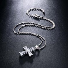 Love the New Elegant Cubic Zirconia Cross Necklace? Sometimes You Never Know The True Value Of A Moment Until It Becomes A Memory. And then you have this beautiful piece of jewelry to remind you of that special moment wherever you go. When was the last time you treated yourself to a lovely gift that reminds you of the most important events in your life? Carry your cross every day and remember what true love looks like. The New Elegant Cubic Zirconia Cross Necklace is carefully crafted with coppe Crystal Cross Jewelry With Adjustable Chain, Diamond White Crystal Cross Necklace, Crystal Cross Necklace With Adjustable Chain, White Gold Crystal Cross Pendant Necklace, Anniversary Cross Pendant Necklace With Cubic Zirconia, Crystal Cross Clavicle Chain Jewelry, Crystal Cross Clavicle Chain, Crystal Cross Pendant Clavicle Necklace, Crystal Clavicle Chain With Cross Shape