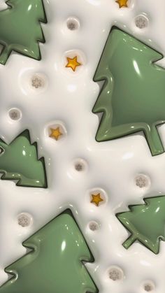 green christmas trees with gold stars on them are in the middle of a white background