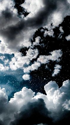 the sky is filled with clouds and stars