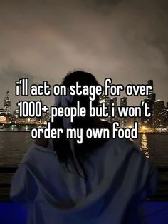 a woman with her back turned to the camera and texting i'll act on stage for over 100 people but i won't order my own food