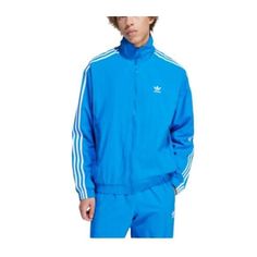 This Is A Brand New With Tags, Unworn Adidas Men's Bluebird Blue Woven Fbird Tt Track Jacket In Size 2xl. It Is Made Of 100% Polyester And Features A Full Zip Front, Two Side Pockets, And A Ribbed Collar And Cuffs. The Jacket Is Also Water-Resistant And Windproof, Making It Perfect For Outdoor Activities. F23 Adidas Blue Track Jacket For Streetwear, Blue Cotton Long Sleeve Track Jacket, Casual Blue Adidas Outerwear, Blue Adidas Track Jacket For Winter, Adidas Blue Track Jacket For Winter, Blue Adidas Track Jacket For Spring, Adidas Blue Track Jacket For Spring, Blue Track Jacket For Sports In Spring, Blue Track Jacket For Spring Sports