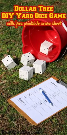 a red bucket with dices on it next to a sheet of paper that says dollar tree diy yard dice game