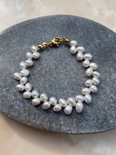 ✨FREE SHIPPING from an order value of 45€ ✨ *Bracelet Lolani* This elegant pearl bracelet adorns your wrist with delicate and beautiful white freshwater pearls. Whether everyday life or beach vacation, this bracelet is always the right choice. Product images are examples. Since pearls are a natural product, the shape and color of the items may vary slightly from the example. Free from nickel, lead and cadmium. *MATERIALS* - Freshwater pearls - Stainless steel clasp 21K gold plated *JEWELRY CARE* White Akoya Pearl Bracelet With Pearl Charm, White Akoya Pearl Charm Bracelet, Minimalist Baroque Pearl Bracelet As A Gift, Minimalist Baroque Pearl Bracelet Gift, Minimalist Baroque Pearl Bracelet, Classic Baroque Pearl Bracelet With Pearl Drop, White Akoya Pearl Chain Bracelet, Everyday White Pearl Jubilee Bracelet, White Akoya Pearl Beaded Bracelets Gift