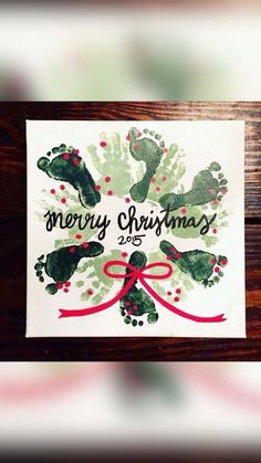 a christmas card with handprints on it