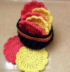 three crocheted baskets sitting on top of a counter